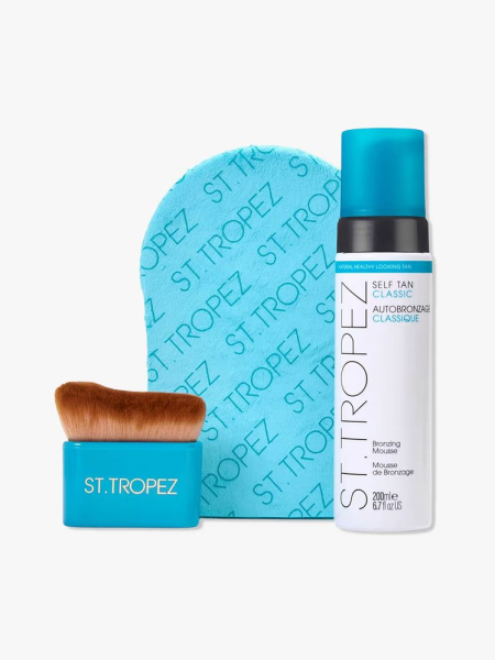 3-Piece St. Tropez Ultimate Tan Body Essentials Kit set with Classic Bronzing Mousse, Tan Body Brush and Velvet Applicator Mitt on light gray background