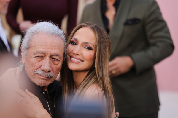 Jennifer Lopez and actor Edward James Olmos pose on the red carpet at the premiere of the movie Office Romance